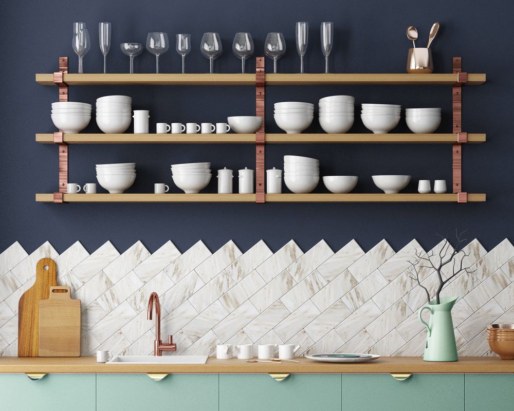 Kitchen shelves stocked with white crockery and glassware